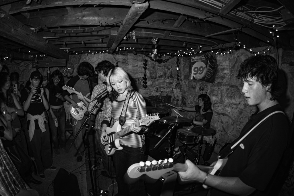first known use playing a basement show, the audience close to the band